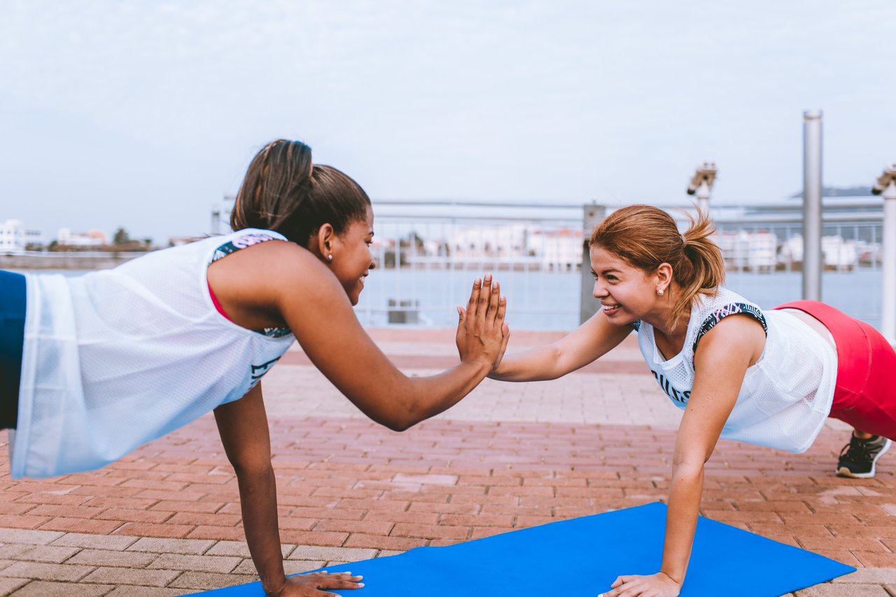 Two women exercise for stress relief